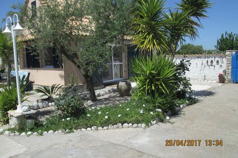 The attractive holiday home is located in Messinia, between the places Velika at 3 km and Petalidi at 5 km where all amenities are available. The holiday home is located directly on the sea, through the garden gate you walk on a narrow sand-pebble be...