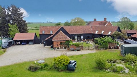 A splendid opportunity to acquire a substantial and characterful five bedroomed detached converted barn situated in a prime hill top location about one mile from the village of Debenham.The accommodation extends up to approximately 3600 square feet a...