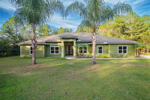 Have you been waiting for THE perfect home on 5 Acres to hit the market in highly desirable St. Johns County? This beautiful custom built home is located in the highly sought after community of World Golf Village This property features 5 acres of woo...