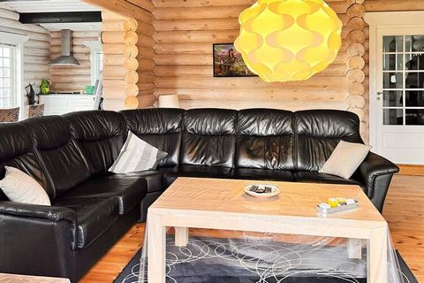 Cottage with whirlpool located within walking distance to the town and the beach and in a quiet and cozy cottage area by Øster Hurup. The cottage is an architect-designed log house with many fine details. Bright and spacious living room in open conne...