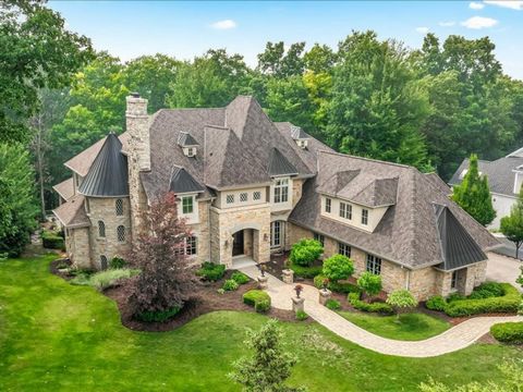 6000 Barclay Drive welcomes you to Old World European Living @ its finest in the highly sought after Pine Creek Ridge neighborhood in Brighton, MI! From your first breath taking view of its exterior with the earth tone stone surrounding the entire dw...