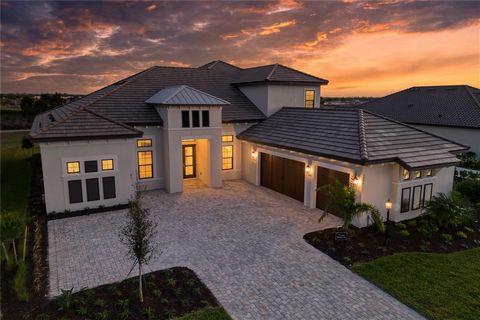 Experience luxury living at its finest in this rarely available south facing Beacon Model perfectly placed with a front side preserve and overlooking the championship Golf Course in Esplanade at Azario, Lakewood Ranch’s finest golf community built by...