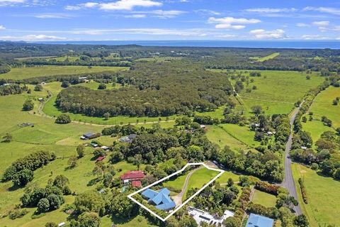 Myocum NSW! Just over the freeway with a sneaky view of Cape Byron Lighthouse, is a large 3 bedroom family home on a gentle lush 1 acre hillside. No 7 Bayfig Place is peaceful and rural but also just a short easy drive into one of Australia's most be...