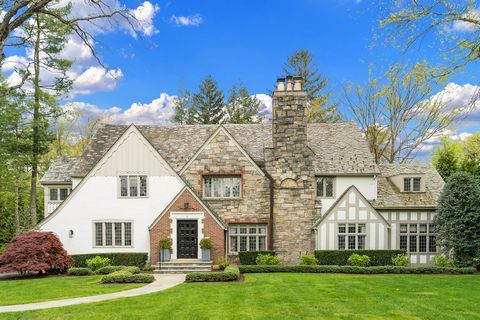 In the heart of Fox Meadow, this 5,600 square foot storybook Tudor is the perfect combination of classic architectural detail with modern amenities of today's design. The sunny entrance foyer welcomes you in - this home sets up like a classic Colonia...