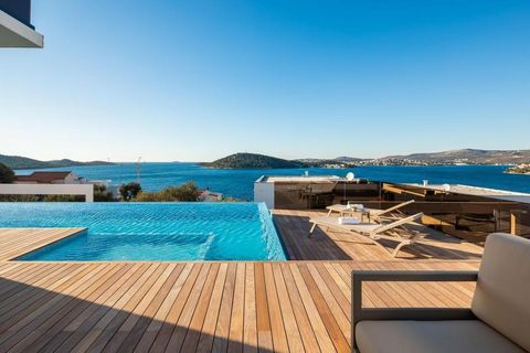 Astonishing luxury villa located in a quiet Dalmatian town near Rogoznica in a fenced complex of three modern villas just 90 meters rom the sea, with amazing sea views! This fantastic villa offers an enchanting blend of modern architecture and natura...