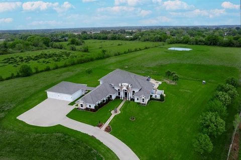Custom home on 11.26 unrestricted acres in Cypress! Featuring a stocked pond, private well, water filtration system, fully wired with CAT 5, buried propane tank, seven car garage, and 9 of the acres are producing hay, making them Ag exempt! Some of t...