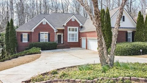 Located in the vibrant and growing Braselton area, near the luxurious Chateau Elan, this custom-built, three-sided brick ranch home sits on over an acre within the private and close-knit community of The Ridge at Chestnut Mountain. High ceilings elev...