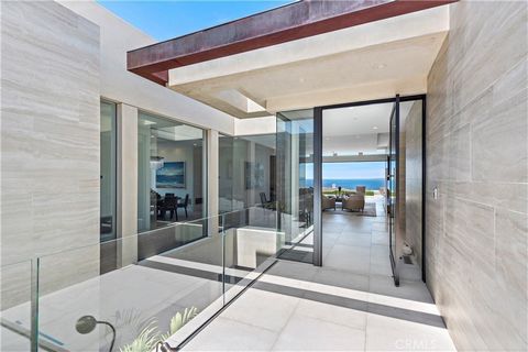 Experience inspirational living in this exquisite contemporary estate in The Strand at Headlands South that offers breathtaking ocean views and approximately 6,264 square feet of luxury living space. Sited on just under a 1/3 acre and also among the ...
