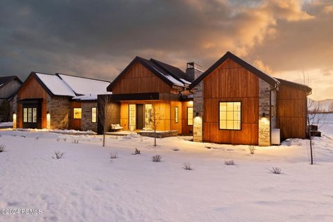 Discover your architectural haven in the exclusive Red Ledges community, where this one of a kind single-level home stretches over an expansive 4, 032 square feet, set against the awe-inspiring backdrop of Mount Timpanogos. Crafted with meticulous at...