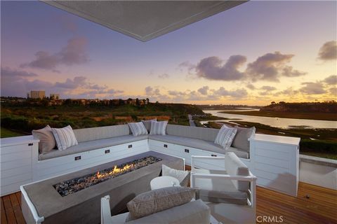 Occupying a coveted front-row position within the tranquil Bluffs of Newport Beach, this exceptional residence, having undergone a complete renovation in 2021, captivates with expansive bay views, light-filled interiors, and a serene ambiance. The ho...