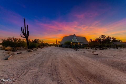 Amazing desert oasis situated on over 2 ACRES in the heart of North Scottsdale! Upon entering, note the cozy front room w/soaring ceilings & NEW Pella large A-frame window panels! The updated kitchen features gorgeous custom cabinetry, white quartz c...