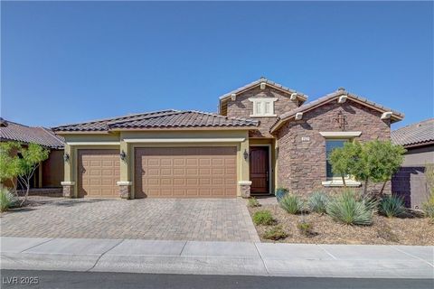 Beautiful One Story Toll Brothers Home with a three car garage in Inspirada! Inside features include three large bedrooms separate from each other, bedroom 2 has an ensuite bath, a large den, shutters throughout, double ovens, a large walk in pantry,...