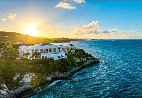 Miramar is the ultimate expression of Caribbean luxury, located on a dramatic waterfront bluff at the edge of the sea that offers sweeping, panoramic views of the turquoise Caribbean Sea and the iconic Buck Island. This landscaped extraordinary estat...