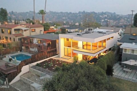 Discover this stunning modern duplex in the heart of Eagle Rock, designed by award-winning AIA architect Martin Fenlon. This architectural gem offers a perfect blend of contemporary design, functionality, and breathtaking 180-degree views of the city...