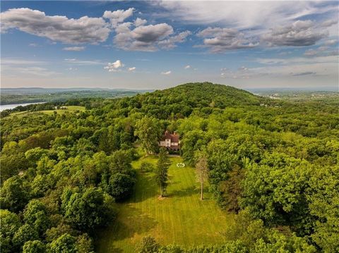 Unsurpassed opportunity. Private family compound or pampering hospitality venue minutes from downtown Hudson!. Exquisite estate on 100 park-like acres with historic 6000SF manor house, 2100SF guest cottage and a cavernous 7,000 SF Barn structure. His...