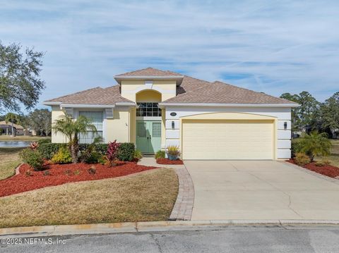 One of the largest waterfront lots in Fleming Island Plantation in the only neighborhood, Fairway Village that includes lawn service. Lovely Open floor plan with volume ceilings in main living areas and views of the lake behind the home. Step out fro...