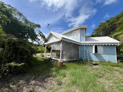 Maison T3 en bois de style créole, vue mer