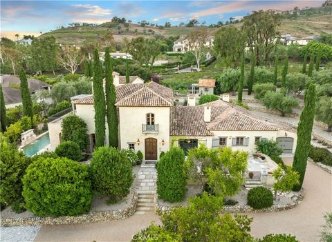 Authentic Provencal gated estate in San Juan Capistrano, with world-class beaches, shopping and dining nearby (but seemingly a world) away. This exquisite private estate is approximately 1-acre of paradise with views of the hillsides, canyons, and pe...