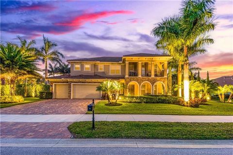 MUST SEE VIDEO! Stunning Estate Pool Home shows like a new model in the much sought after gated community of Tres Belle. Natural preserve in the front AND rear of the home makes this your personal sanctuary. Extensive tropical landscaping, exterior a...