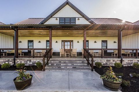 Truly exceptional! This modern farmhouse masterpiece has everything. This charming property boasts a unique blend of rustic elegance and modern convenience, making it the perfect place to call home or use as a vacation getaway. Stunning and spacious,...