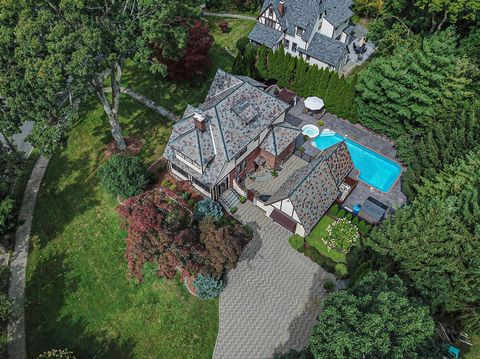 Welcome to a one-of-a-kind Storybook Tudor on .40 acre of beautiful landscaped property and mature trees. The architectural details of this brick and stucco exterior is complimented by the well-appointed slate roof. The extensive frontage of manicure...