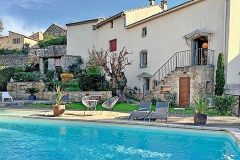 At the heart of a charming village with shops in Le Gard, come discover these two independent houses linked by a garden. Built of stone, the first house offers a living-room with open kitchen, 3 bedrooms, and an independent studio. The second house o...