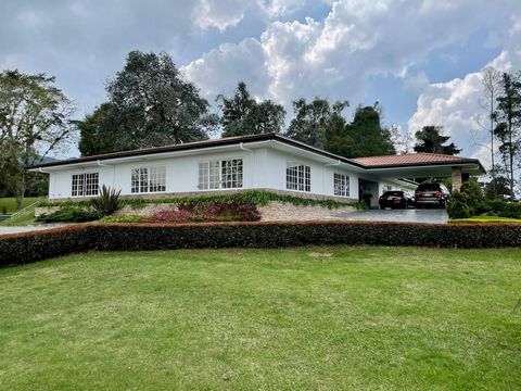 Spectacular detached house in the top of Las Palmas, Medellín. It features: 2 indoor parking spaces and up to 11 outdoor parking spaces Terrace in the surroundings of the house Large green areas House attached to the main Orchard Spacious entrance ha...