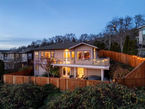 Discover a pristine, 2004-built home perched on Christmas Hill, offering unparalleled views of ocean, city & mountains. Enjoy south/west-facing decks w/awe-inspiring sunsets & twinkling city lights & the beauty of the Olympic Mountains & Sooke foothi...