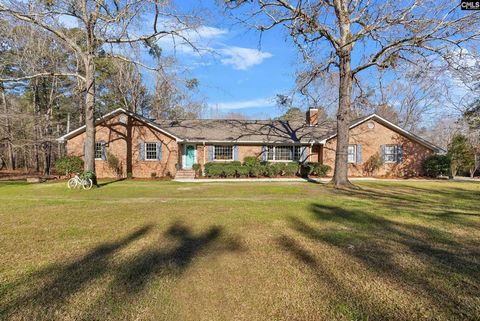 Welcome to 124 N Melton, a home where comfort meets county living on an expansive 4.87-acre property in the heart of Blythewood. This residence offers the perfect balance of space, style, and potential. Begin your day in the bright, sunlit kitchen, t...