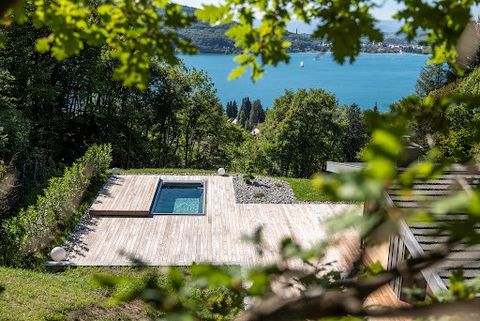 Confidential and secret. This unique property is nestled in the middle of a clearing on the heights of Annecy. At the foot of Mont-Veyrier, the place is incredible, absolute calm, an unparalleled view of the lake, and the house... elegant and bright,...