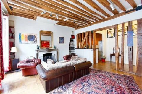 Rue des Fontaines-du-Temple, in an old building, on the 2nd floor without elevator, a crossing apartment of 89 m2 between courtyard and garden, comprising: Entrance Stay 2 bedrooms Bathroom Kitchen Cellar Ceiling height of 3.6 m