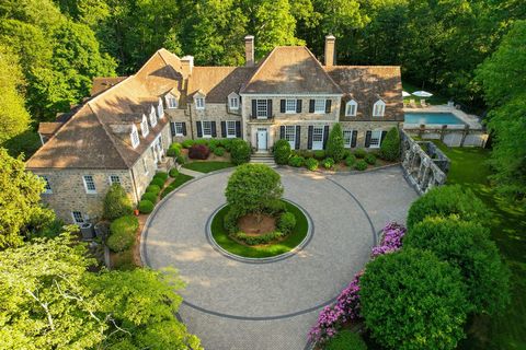 Beautifully sited on 4+ private acres is a spectacular 1930 Georgian stone manor home with every amenity one could wish for. 'Laurel Hill' was designed by renowned architect William Lawrence Bottomley. This 7,200 sq ft, 7 bedroom home has been though...