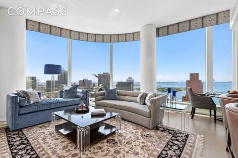 Majestic water views unfold at your feet in this unparalleled two-bedroom, two-and-a-half-bathroom showplace perched high on the 45th floor at 50 West, an exemplary full-service condominium. Inside this spectacular 1,510-square-foot high-floor reside...