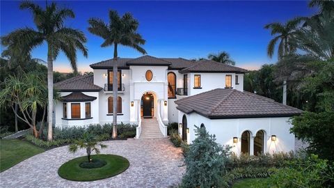 Nestled within the prestigious Bay Isles Harbor Section community, this residential masterpiece, crafted by luxury home builder Murray Homes, epitomizes waterfront luxury living. Boasting five bedrooms and nearly 7,000 square feet of meticulously upd...