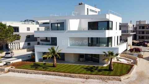 www.biliskov.com  ID: 14180 Sukošan-first row to the sea A beautiful five-room luxurious two-story apartment with a total net area of 178.02 m2 on the 1st and 2nd floor of a newly built urban villa. The first floor of the apartment consists of an ent...