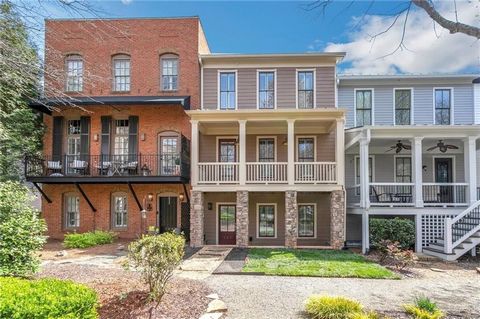 Elevate your lifestyle with this rare gem nestled in the heart of downtown Woodstock, GA. As the premier luxury real estate agent in the area, I am thrilled to present to you an unparalleled opportunity to own a stunning town-home that redefines urba...