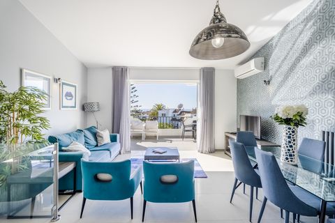 On the upper floor, you'll find the main living area, composed by an open-plan design that seamlessly integrates a fully fitted kitchen with the living space. This area opens onto a south-facing terrace, providing stunning views of the black rock for...