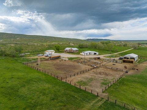 Moccasin Land & Livestock is located just 5 minutes from downtown Lander Wyoming, and is comprised of 160+/- acres, large home, multiple outbuildings, and new set of corrals and loafing shed with end of the road privacy.The property consists of appro...
