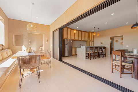 Experience unparalleled luxury in Todos Santos with this single floor detached condo. Boasting 2 bedrooms and 2.5 baths the fully furnished residence is a haven of sophistication. Artfully designed the interior features artisan crafted furniture crea...