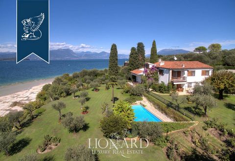 In Sirmione, in an exclusive lake front position there is this villa for sale. The estate measures approximately 500 m2 overall, also featuring an outbuilding that measures approximately 150 m2. The villa is distributed on three floors, on the ground...
