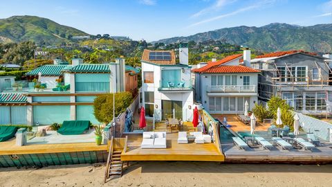 Click Here For Full Gallery, Video, & Tour: https:// ... / Nestled along the stunning Malibu coastline, this oceanfront estate boasts majestic ocean views and sun-soaked decks on the sand. Designed for exquisite comfort and impressive entertaining, t...