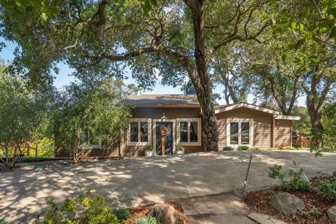 It would be difficult to imagine a more perfect setting. Completely hidden from the road, this 1.06-acre property delivers rare seclusion and breathtaking views - yet its only a half mile from Portola Rd. The 3 bed, 3 bath home offers 2090 sq ft of r...