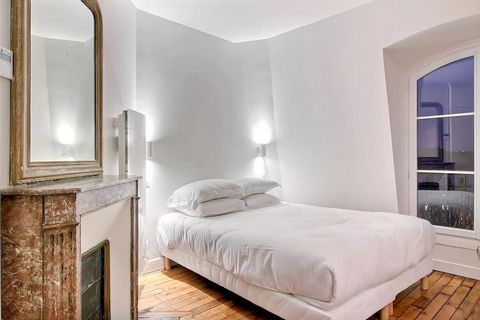 The flat: With its marble fireplace, antique mirror and beautiful parquet flooring, this flat has all the charm of a typical Paris flat. The view over the roofs of Paris makes it particularly pleasant. A few touches of grey, pink and blue embellish t...