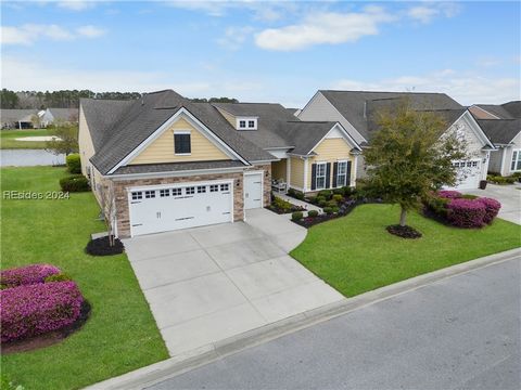 Experience the ultimate in luxury living with this magnificent 3BR/3BA+Den Dunwoody Way, nestled on a spectacular water to golf homesite in the highly coveted Herons Pointe neighborhood. The home boasts wide plank hardwood floors, crown molding, and ...