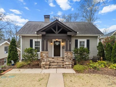 Welcome to this beautifully renovated Bungalow located just minutes from Historic Marietta Square. This charming home has been updated to the max! From the gorgeous quartz countertops and wood flooring to the stainless steel appliances and cozy livin...