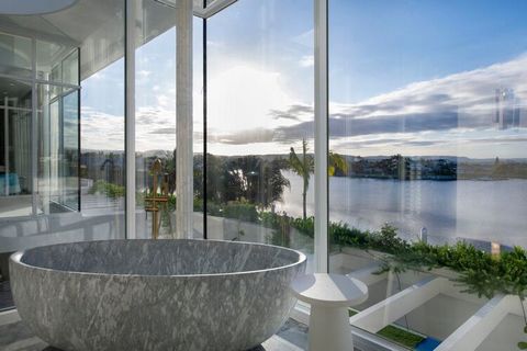 Architect Mason Bright and local developer Capital Luxury Residences have joined forces to deliver 'Armorel', a contemporary double-storey house inspired by the luxurious hotels of southern Florida. Floor-to-ceiling glazing and expansive sky lights w...