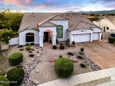 If you are looking for a completely updated move-in ready Oro Valley home with designer finishes throughout to WOW you, put this home on your list! A meticulously maintained property with soaring ceilings and large windows that frame dramatic sunsets...