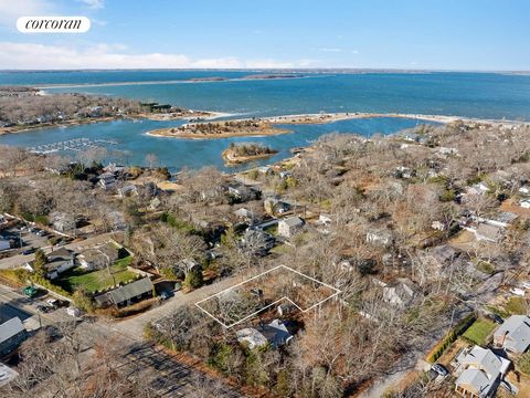 All offers considered! Large lot in waterfront neighborhood of Pine Neck, Sag Harbor. 1/4 acre with existing structures. 1,220 house and 2 car garage. Tear down or renovate. Circle Beach, Cromer's grocery, restaurants and shops located conveniently n...