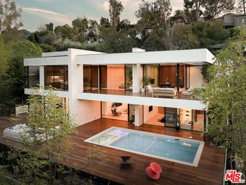 Nestled within the scenic hills of Studio City, 3748 Berry Drive is a testament to architectural brilliance and modern sustainability. This 6,264 sq.ft. net-zero masterpiece, crafted by Maison by PGB, seamlessly merges cutting-edge design with mid-ce...