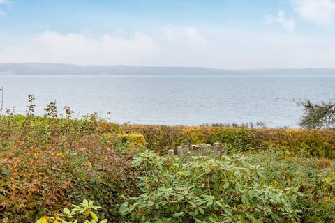 Completely renovated cottage with a view of the sea at Mørkholt. There are terraces almost all around the house and in the middle of the garden, so you can enjoy the view and the sun all day. The cottage is located in a quiet area by a very child-fri...